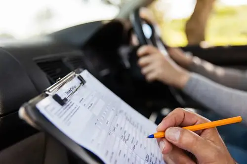 A person taking note for smog check

